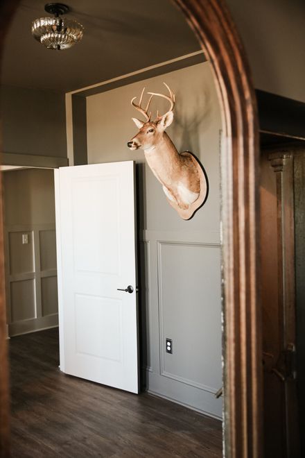 Groom’s suite door and mounted antlers